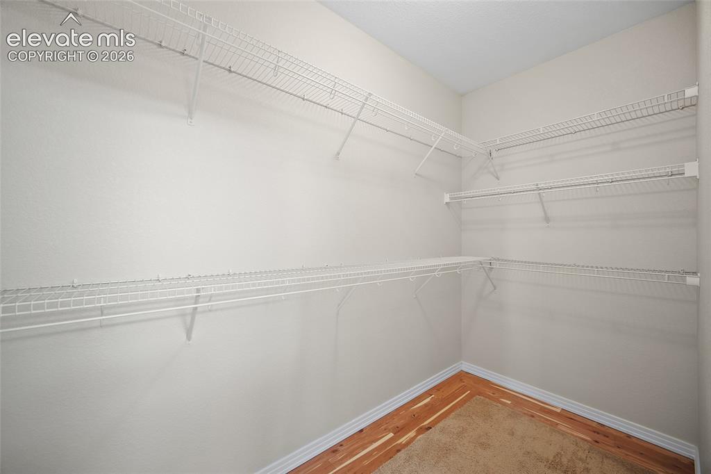 Image 21 of 40: Cedar Lined Walk-in Closet in Primary