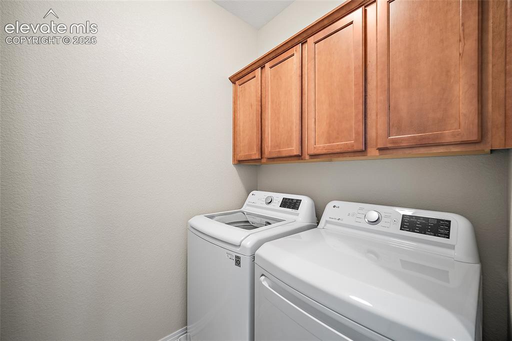 Image 30 of 40: Laundry Room with Cabinets