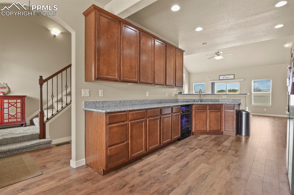 Image 11 of 45: Main level kitchen, entrance and living