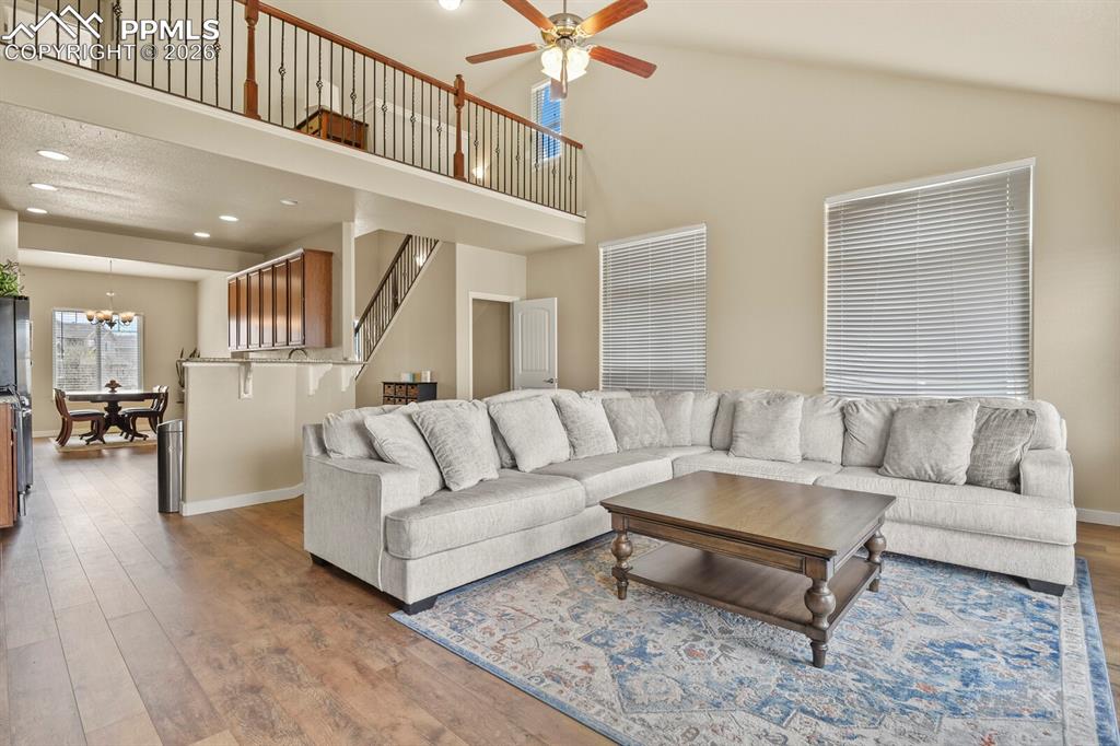 Image 12 of 45: Main level living room, kitchen and upper loft area