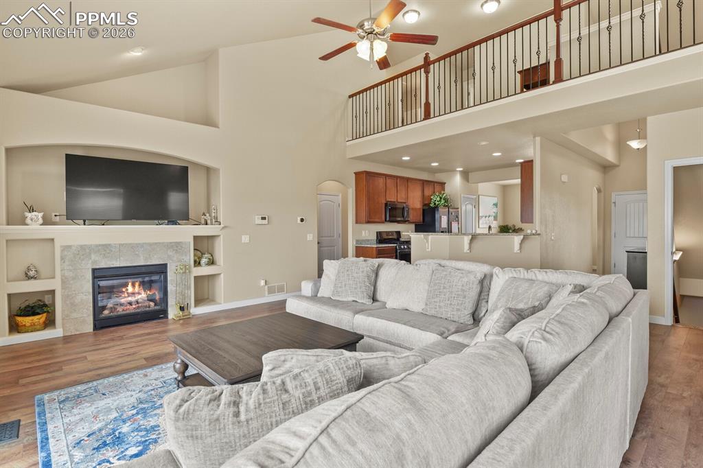 Image 13 of 45: Main level living room, kitchen and upper loft area