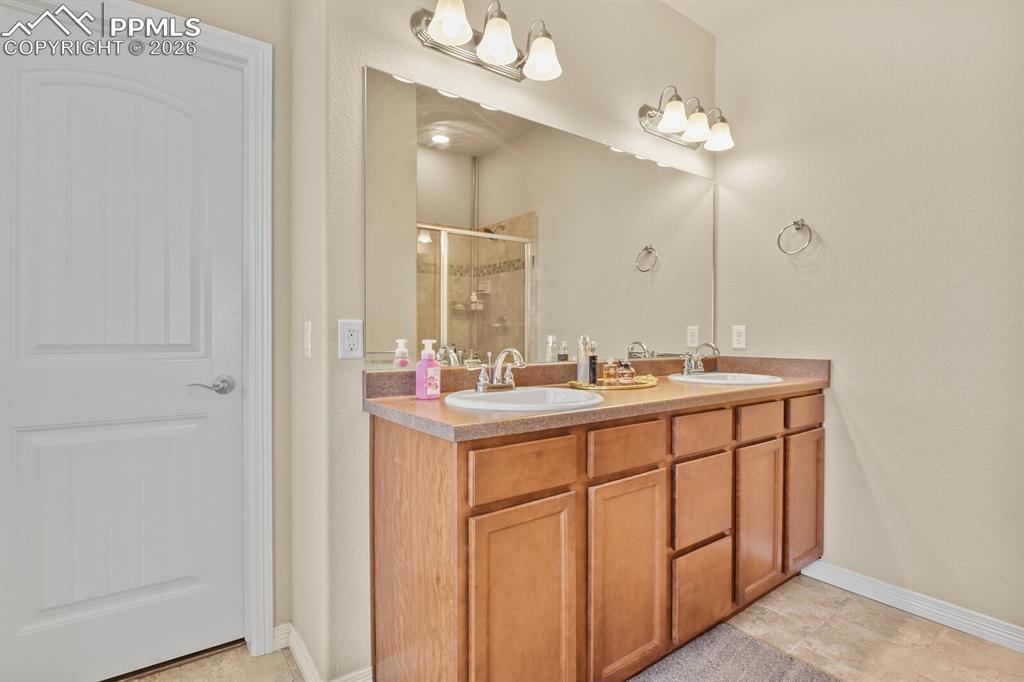 Image 18 of 45: Main level bedroom attached bathroom