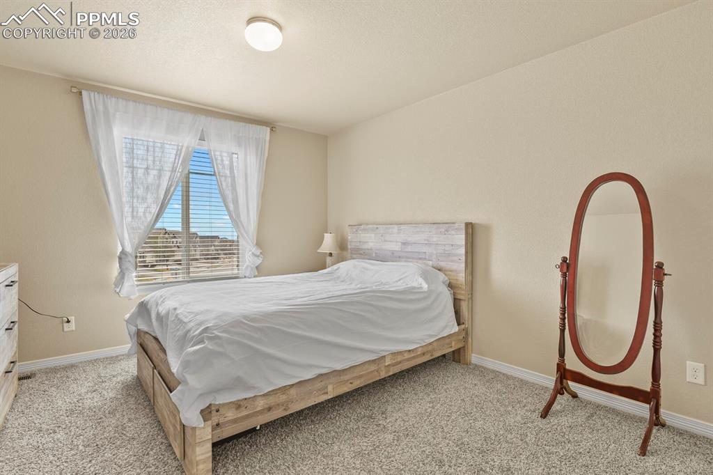 Image 28 of 45: Upper bedroom