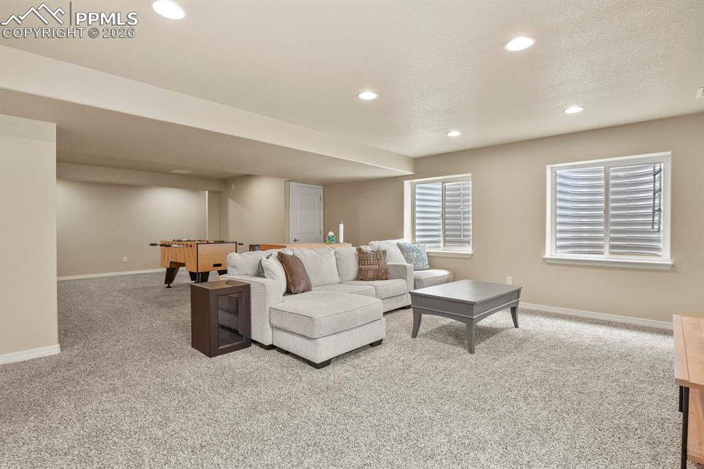 Image 36 of 45: Basement living room and game area