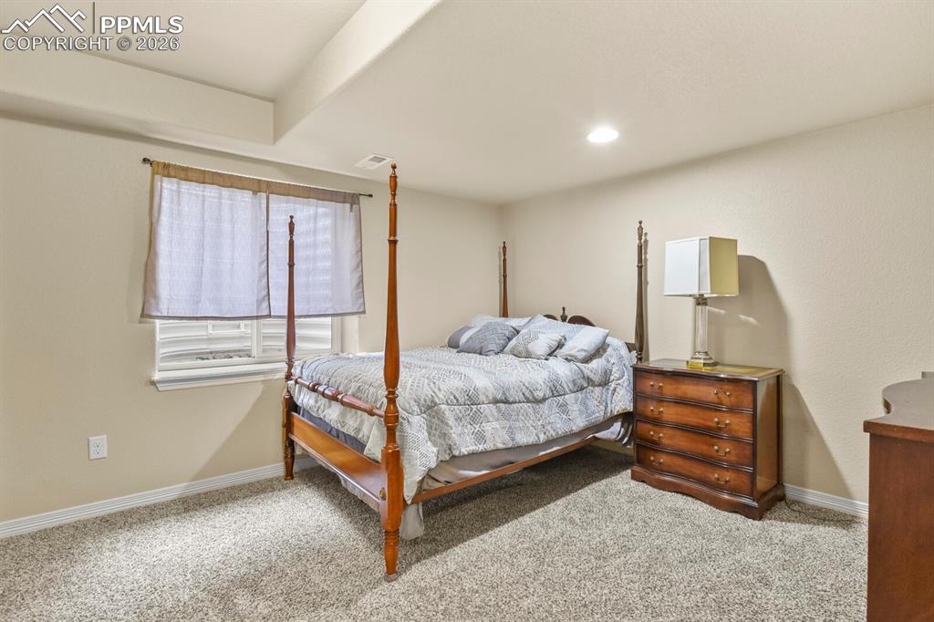 Image 41 of 45: Basement bedroom