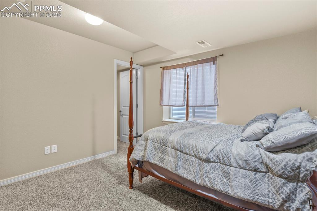 Image 42 of 45: Basement bedroom