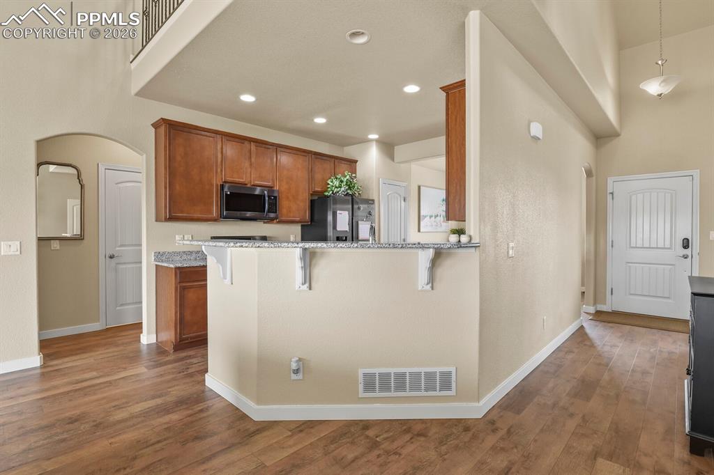 Image 7 of 45: Main level kitchen and front door entrance