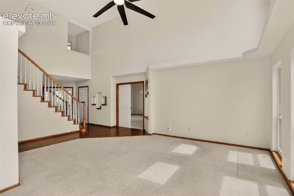 Image 18 of 50: Living room (primary bedroom door seen in photo)