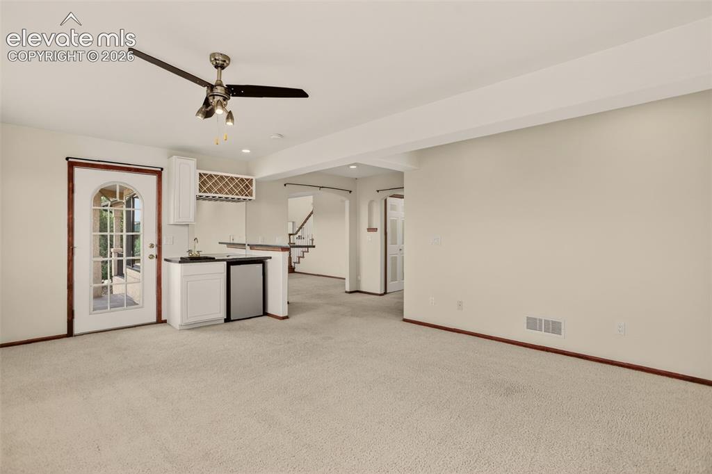 Image 31 of 50: Family room. Entryway goes right to the kitchen and left to the formal dini