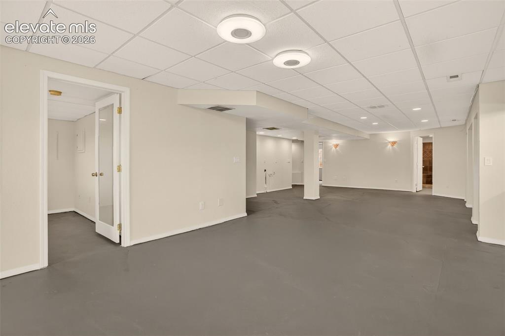 Image 47 of 50: Office to the left. Bathroom to the back. Roughed-in kitchen to the rear/le