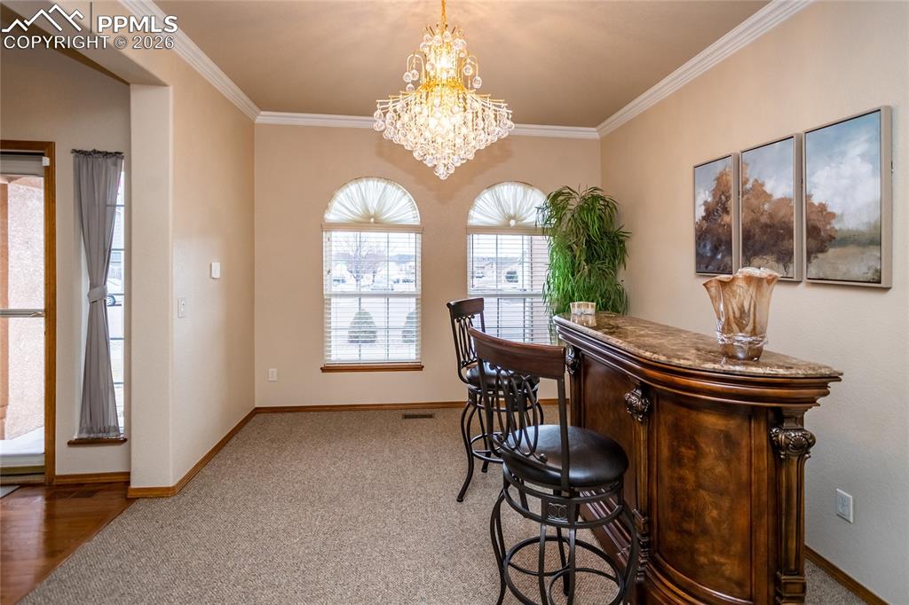 Image 10 of 50: Dining room is big enough to accommodate a large dining table and a hutch. 