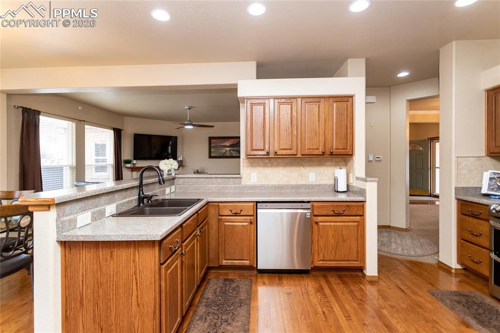Image 15 of 50: Kitchen features hardwood flooring.