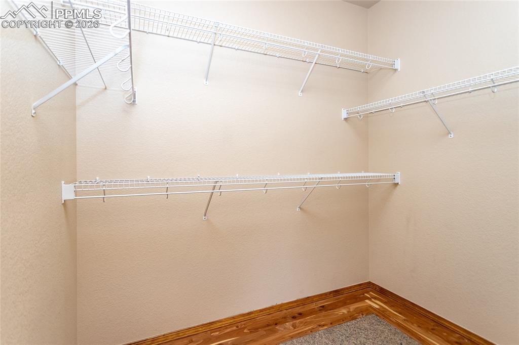 Image 28 of 50: Generous walk-in closet with cedar lining is about 8