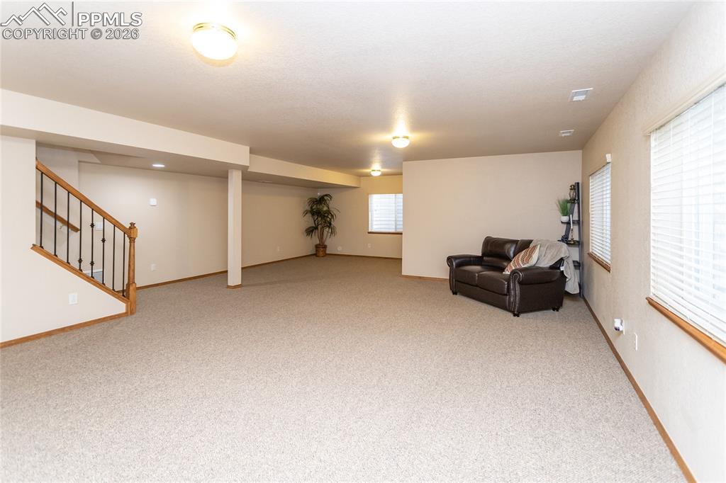 Image 33 of 50: Huge rec room in the basement offers many possibilities!