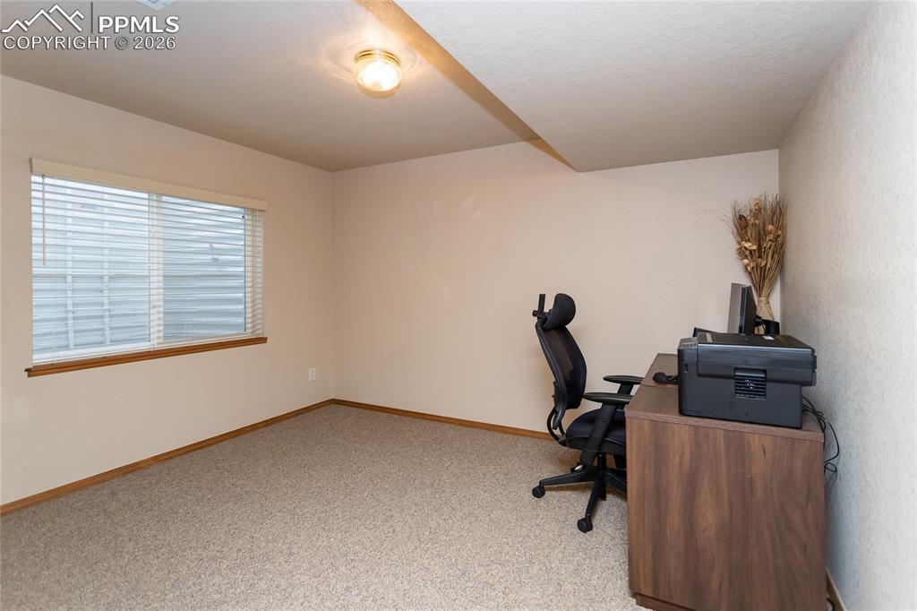 Image 36 of 50: Bedroom #3 in the basement is currently used as an office.