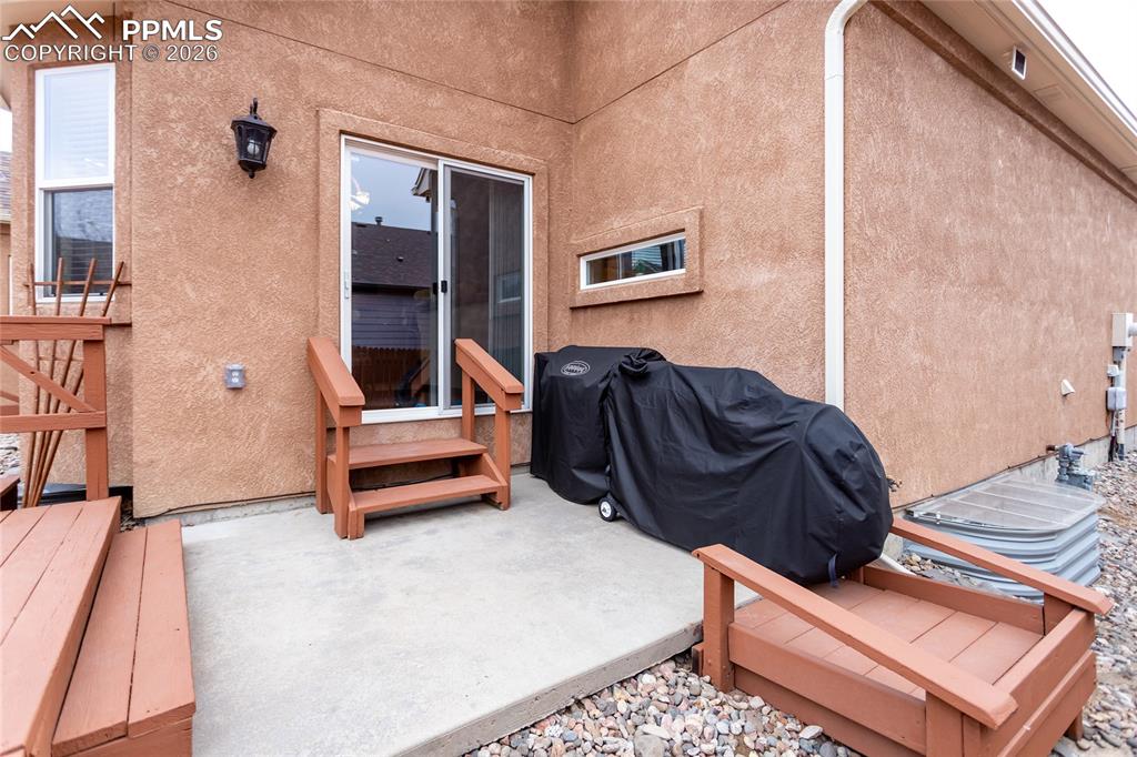 Image 46 of 50: Back patio off the kitchen nook.