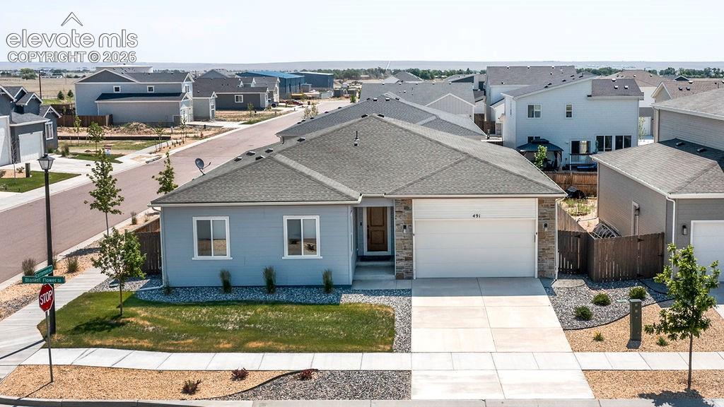 Image 1 of 47: Single-story residence featuring light gray siding with stone veneer accent