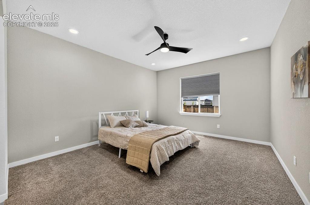Image 24 of 47: Carpeted room featuring a modern ceiling fan, recessed lighting, neutral wa