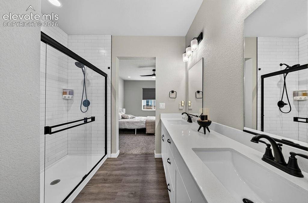 Image 28 of 47: Double vanity with integrated sinks and white countertops