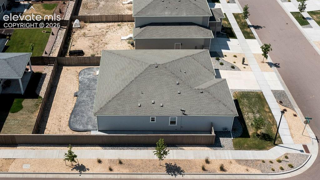 Image 7 of 47: Gray shingle roofing and light gray siding