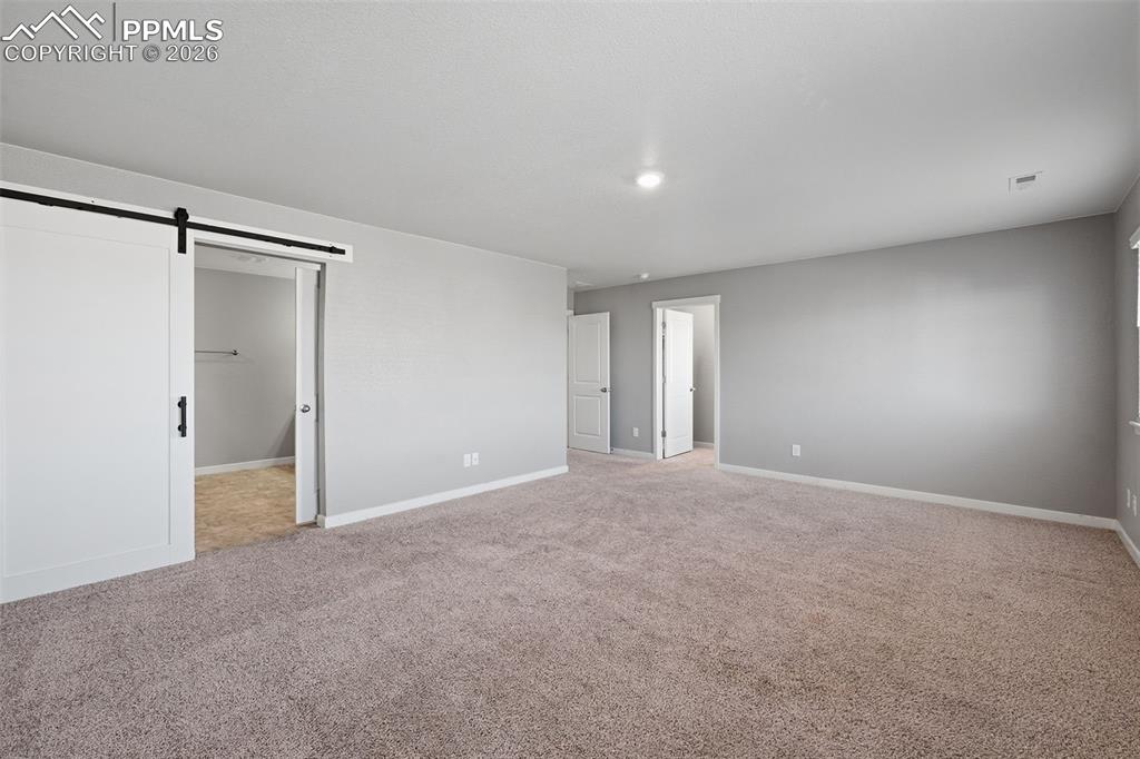 Image 16 of 29: Primary Bedroom in Upper Level