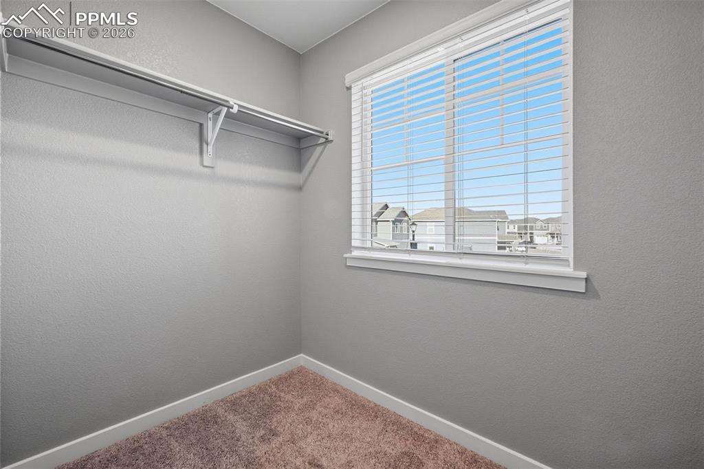 Image 18 of 29: Primary Bedroom Walk-in Closet