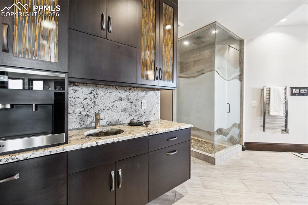 Image 21 of 50: Morning kitchen with refrigerator, microwave and sink.