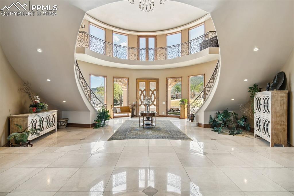 Image 6 of 50: Rotunda-style foyer with suspended arch ceiling