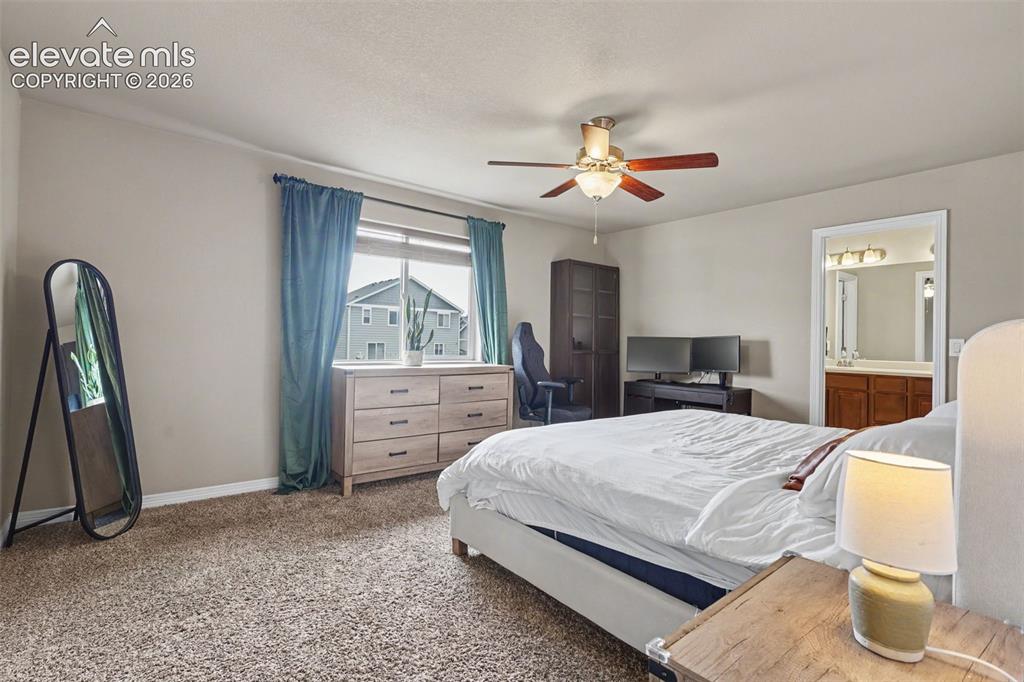 Image 20 of 40: Spacious room featuring neutral paint, textured carpeting, a window with bl