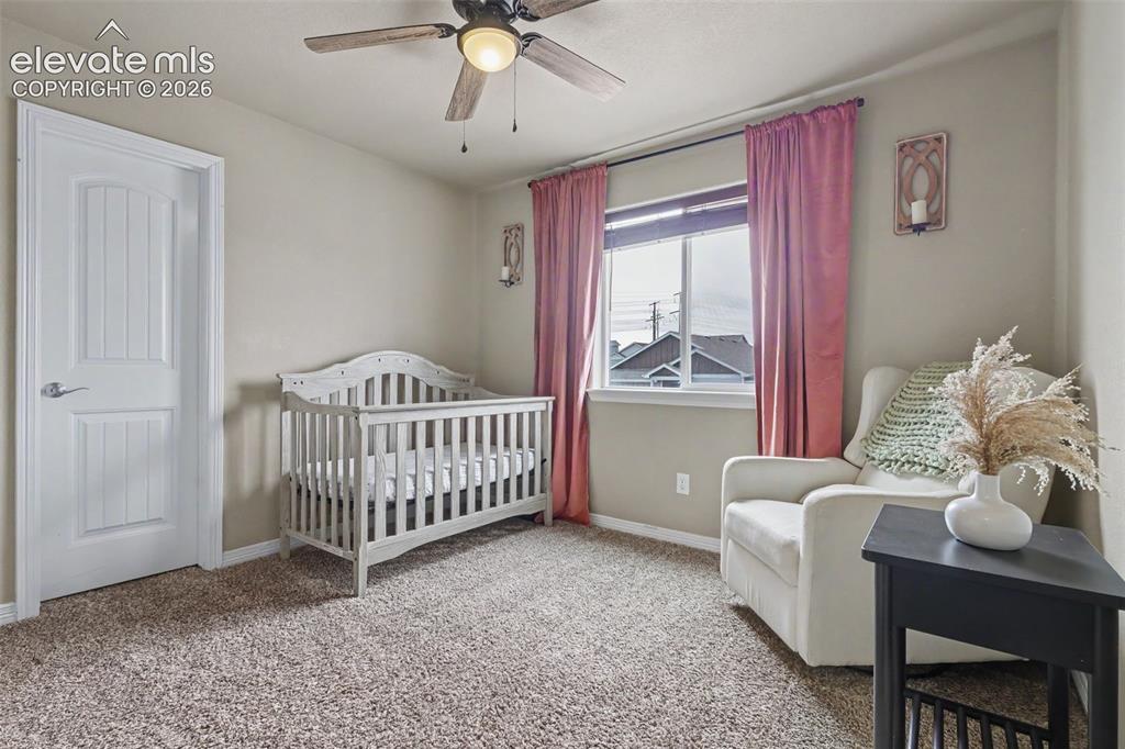 Image 25 of 40: Neutral-toned wall paint complements the light-colored carpeting