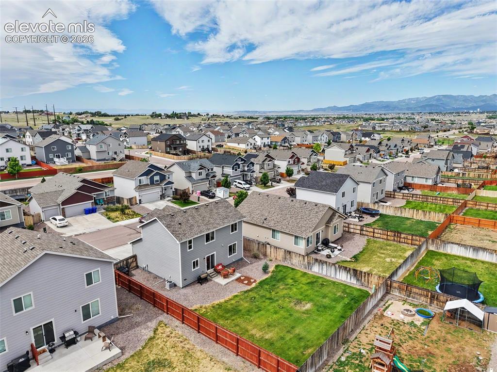 Image 35 of 40: Expansive neighborhood featuring numerous detached residences with varied a