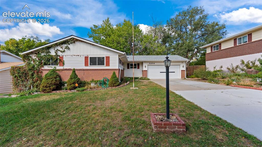 Image 1 of 36: Nicely landscaped, fenced yard