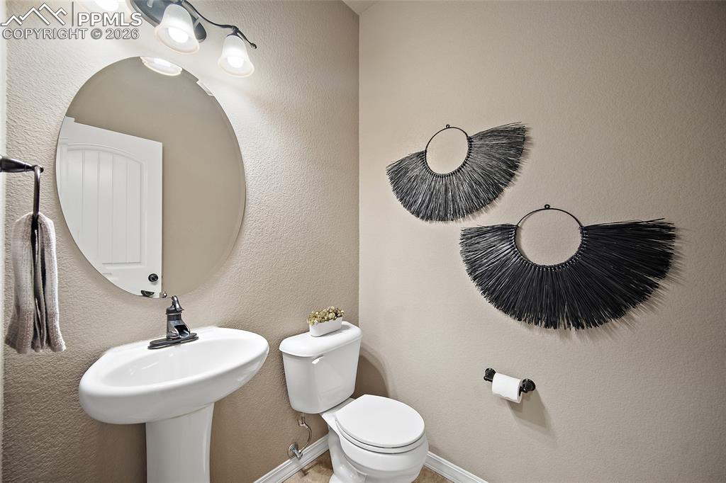 Image 8 of 50: 1/2 bath on main level.