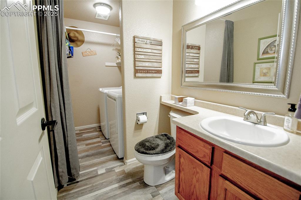 Image 25 of 33: Downstairs bathroom attached to laundry