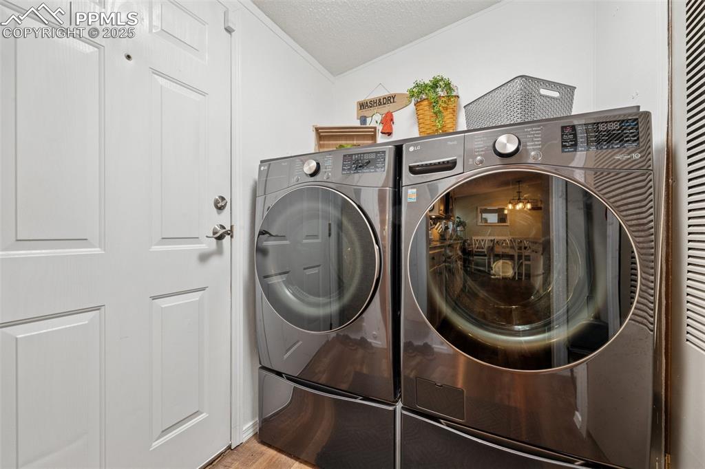 Image 23 of 33: Mud room/laundry room with back yard access.  Washer and dryer are NOT incl