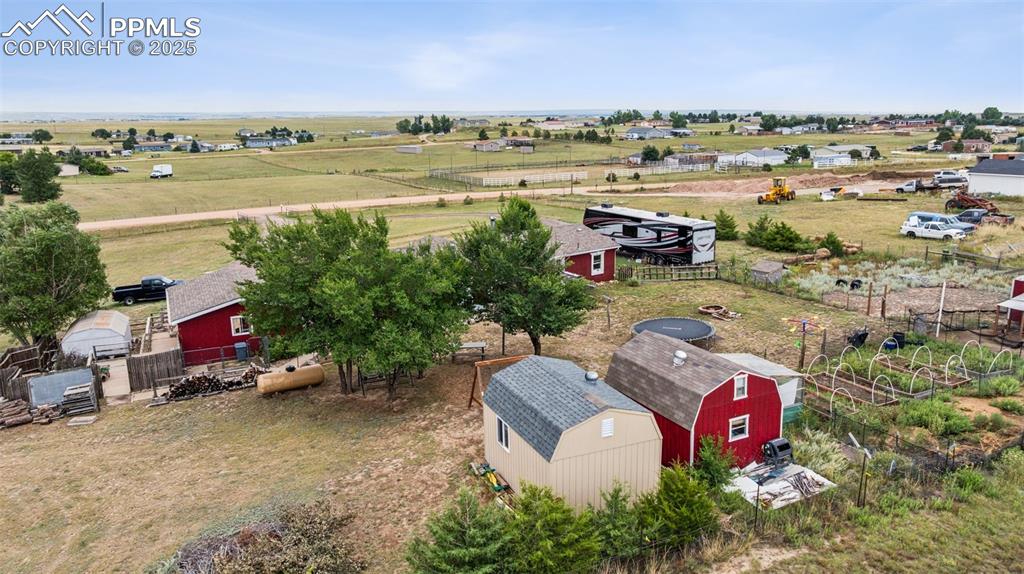 Image 4 of 33: Two large sheds with power and both have lofts.