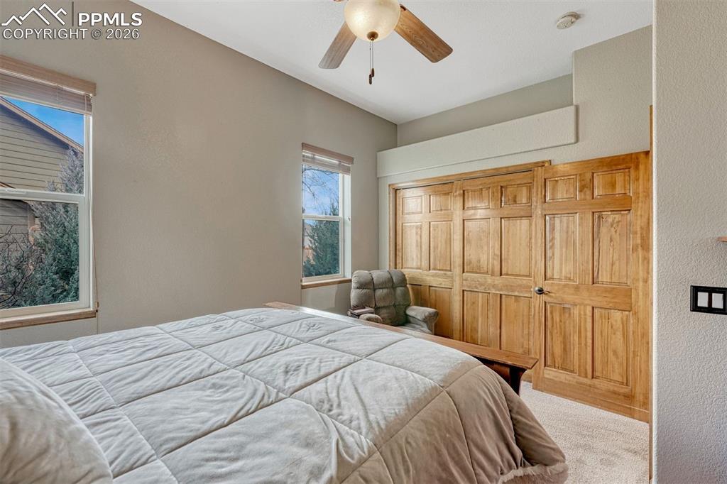 Image 20 of 45: 2nd main level bedroom. Carpeted bedroom with a nice  closet 