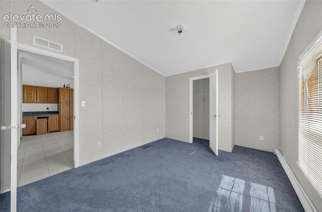 Image 14 of 41: Carpeted flooring and built in closet
