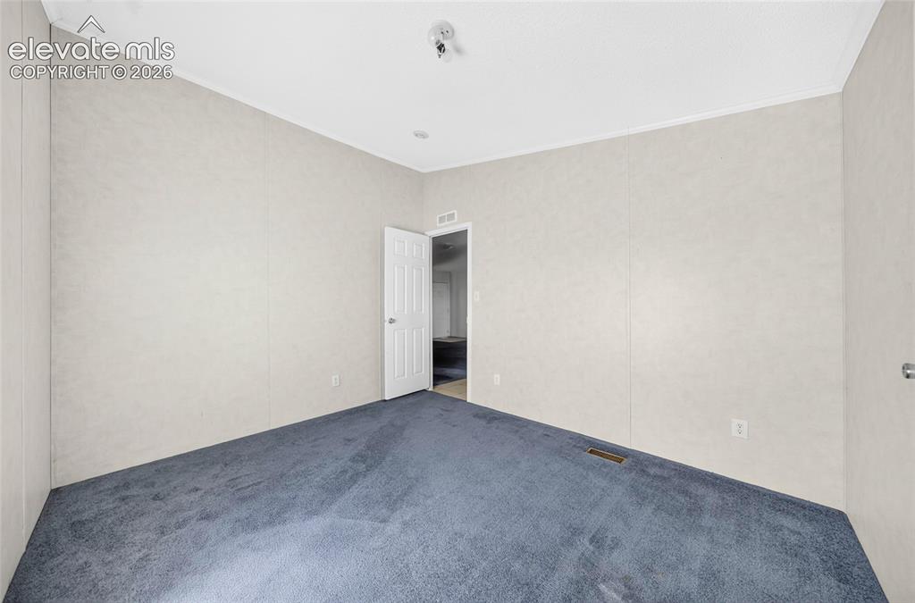 Image 15 of 41: Carpeted flooring and a built-in closet