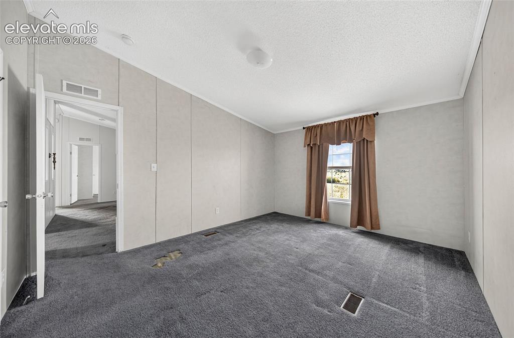 Image 18 of 41: Primary bedroom, adjoining bathroom, walk in closet