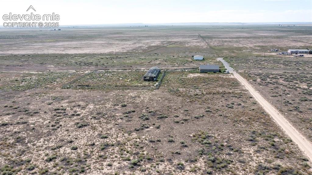 Image 32 of 41: Expansive rural landscape with multiple structures