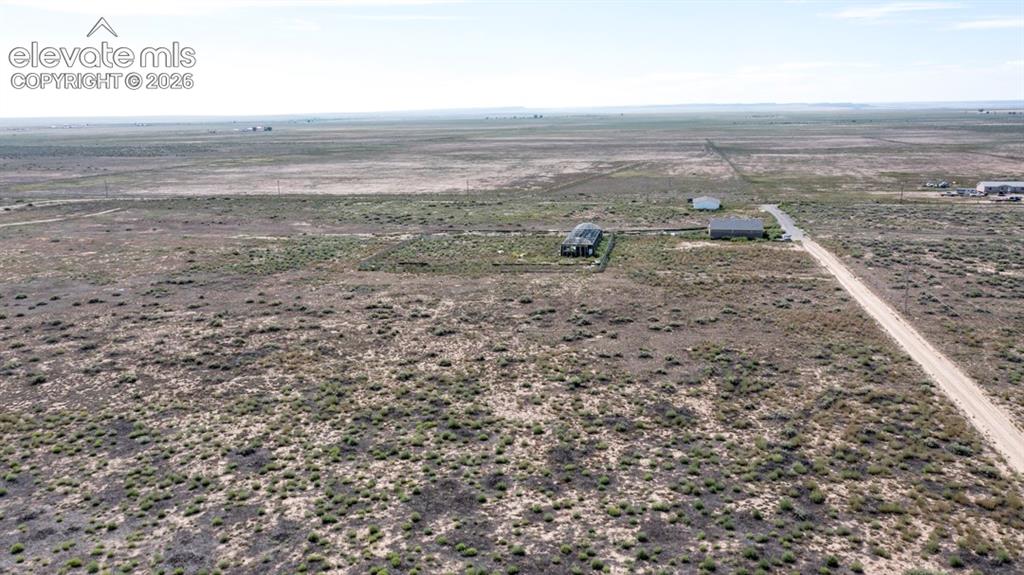 Image 33 of 41: Expansive rural landscape with multiple structures