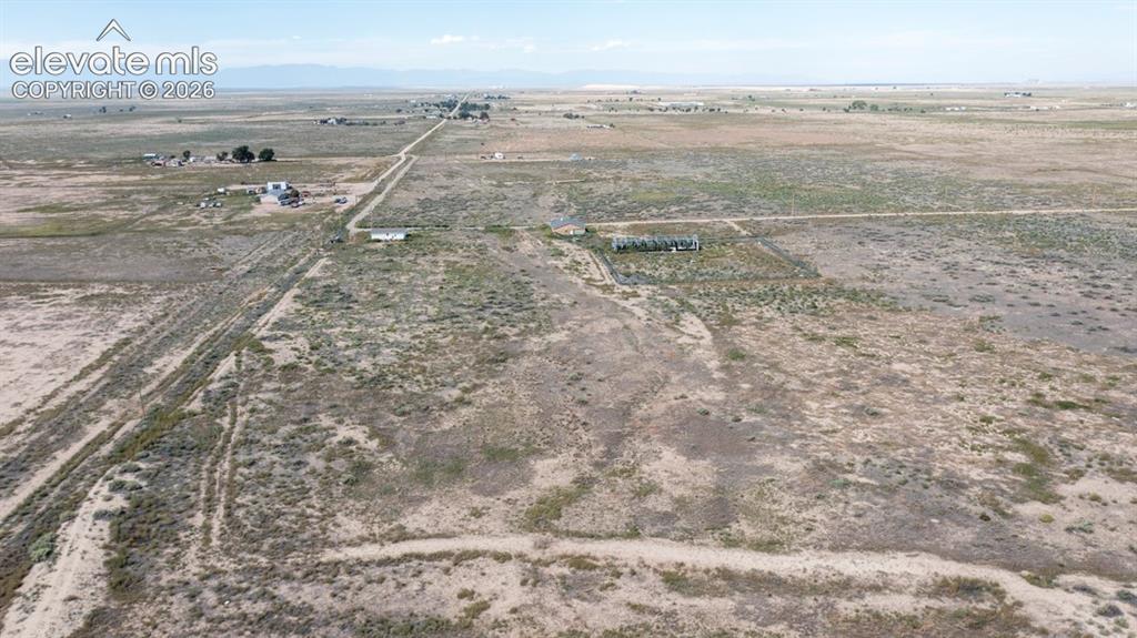 Image 34 of 41: Expansive rural landscape with multiple structures