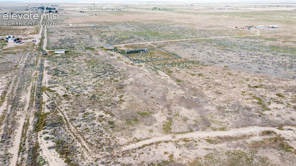 Image 35 of 41: Expansive rural landscape with multiple structures