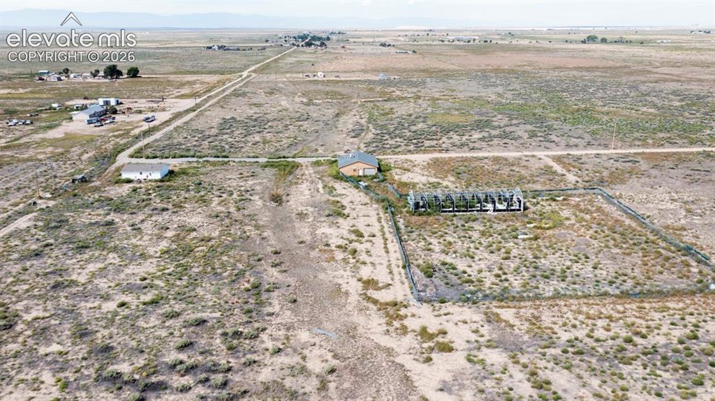 Image 36 of 41: Expansive rural landscape with multiple structures