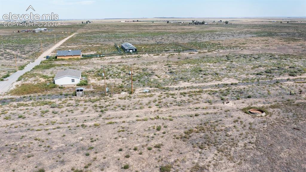 Image 37 of 41: Expansive rural landscape with multiple structures