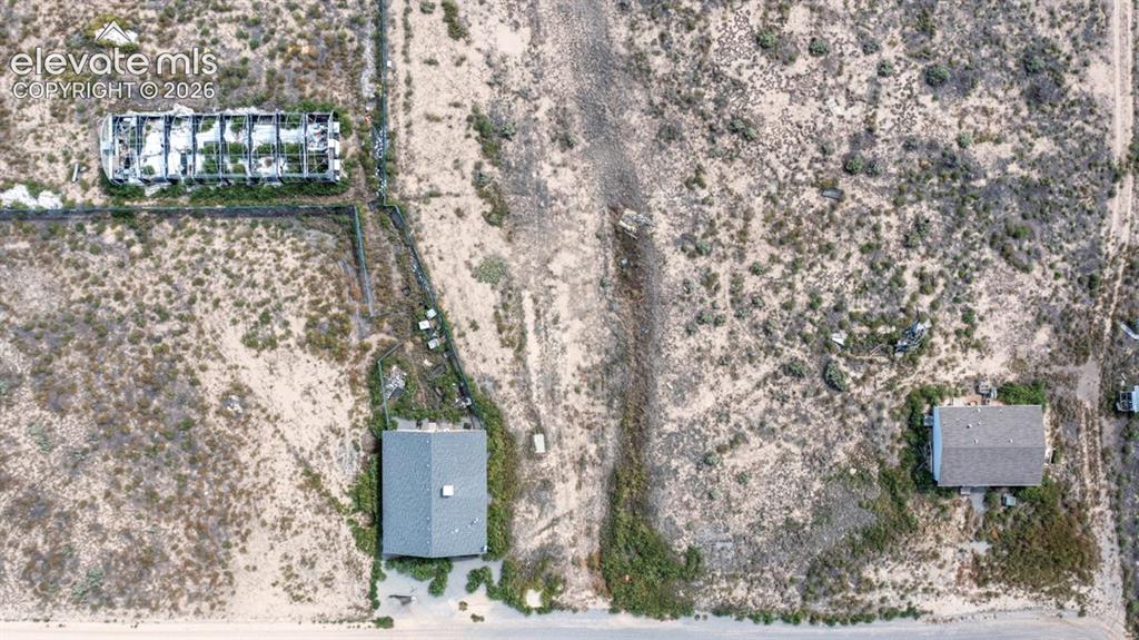 Image 38 of 41: Manufactured home, shop, and greenhouse