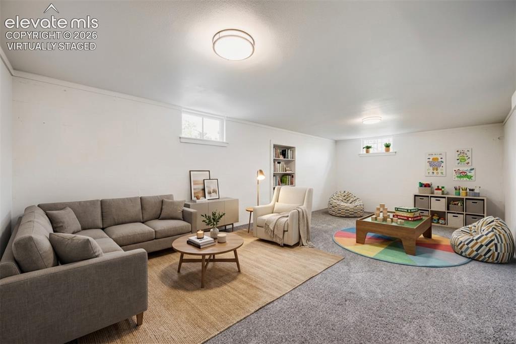 Image 24 of 41: Recessed lighting, light-colored walls, built-in shelving, and multiple win