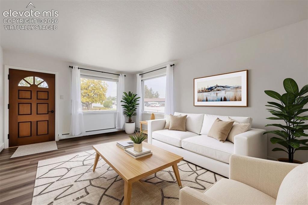 Image 3 of 41: Wood-finish flooring throughout. Virtually staged.