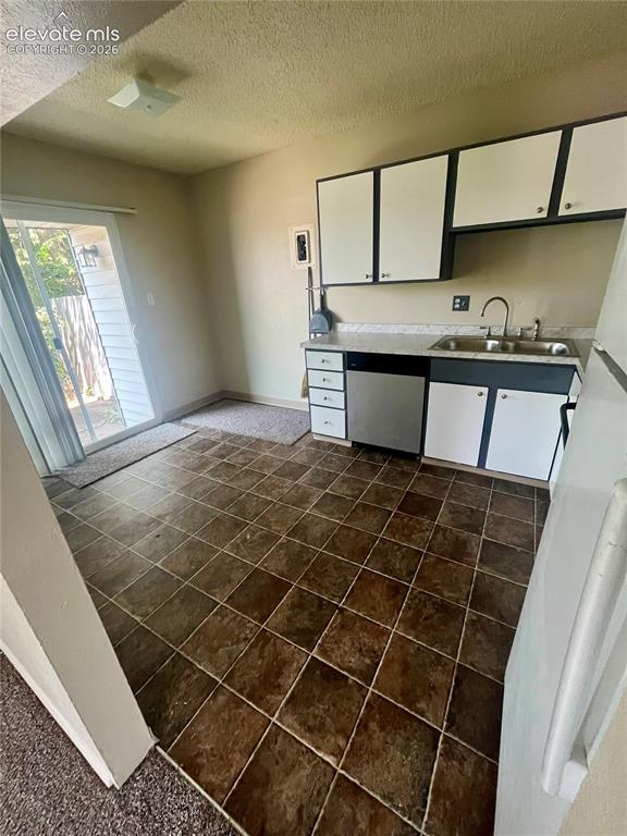 Image 10 of 27: eat in kitchen w/SGD leading to patio